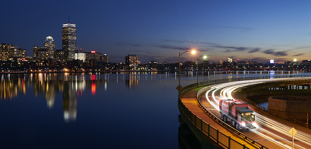 WIN trucks near Charles River at night